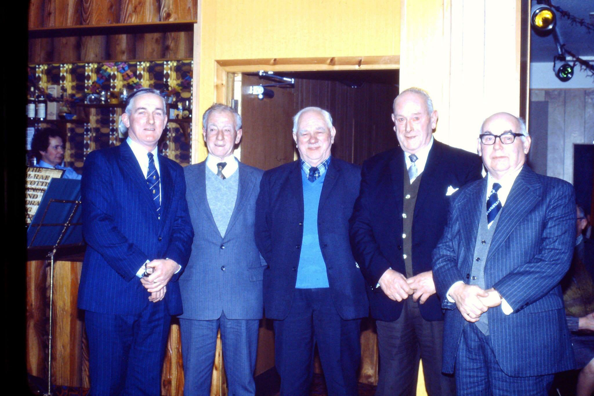 Neddie Melville receiving a gift at
        the Firemen's Party.